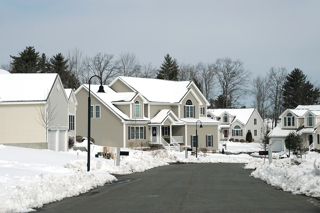 Snow covered homes in a neighborhood