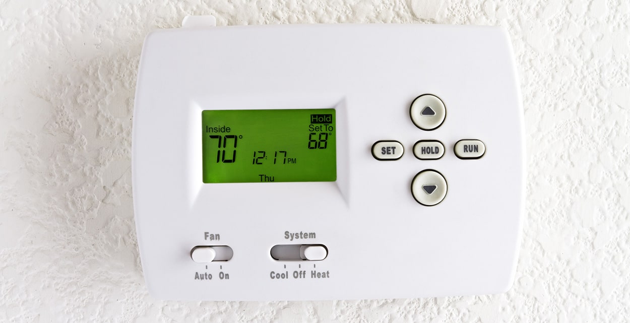 Thermostat on the wall of a home
