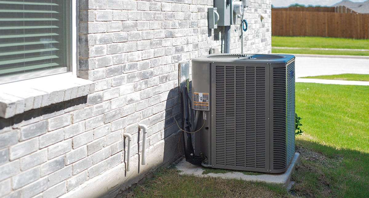 Air conditioner on the side of a home