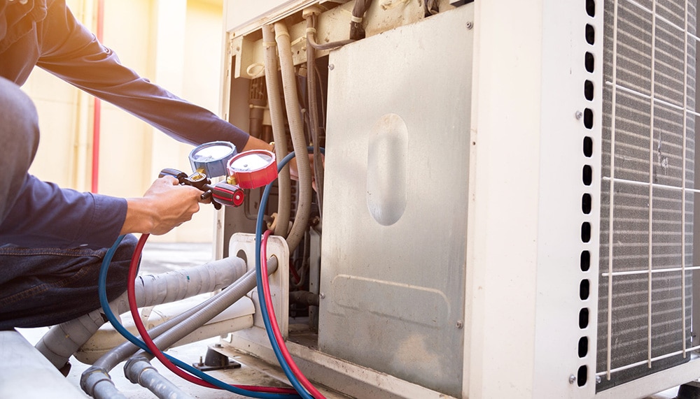 HVAC Technician Working on an Air Conditioner