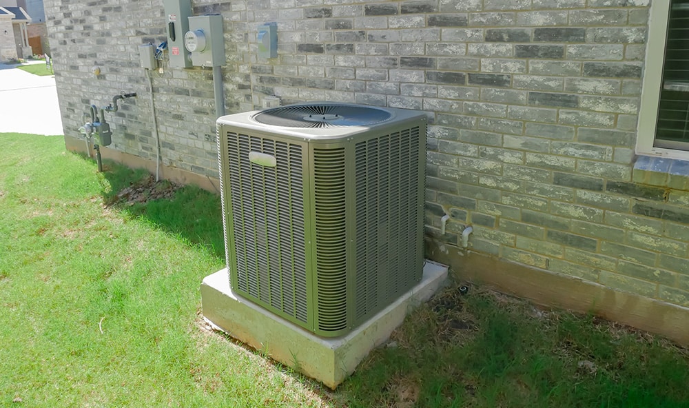 Home ac unit on the side of a house